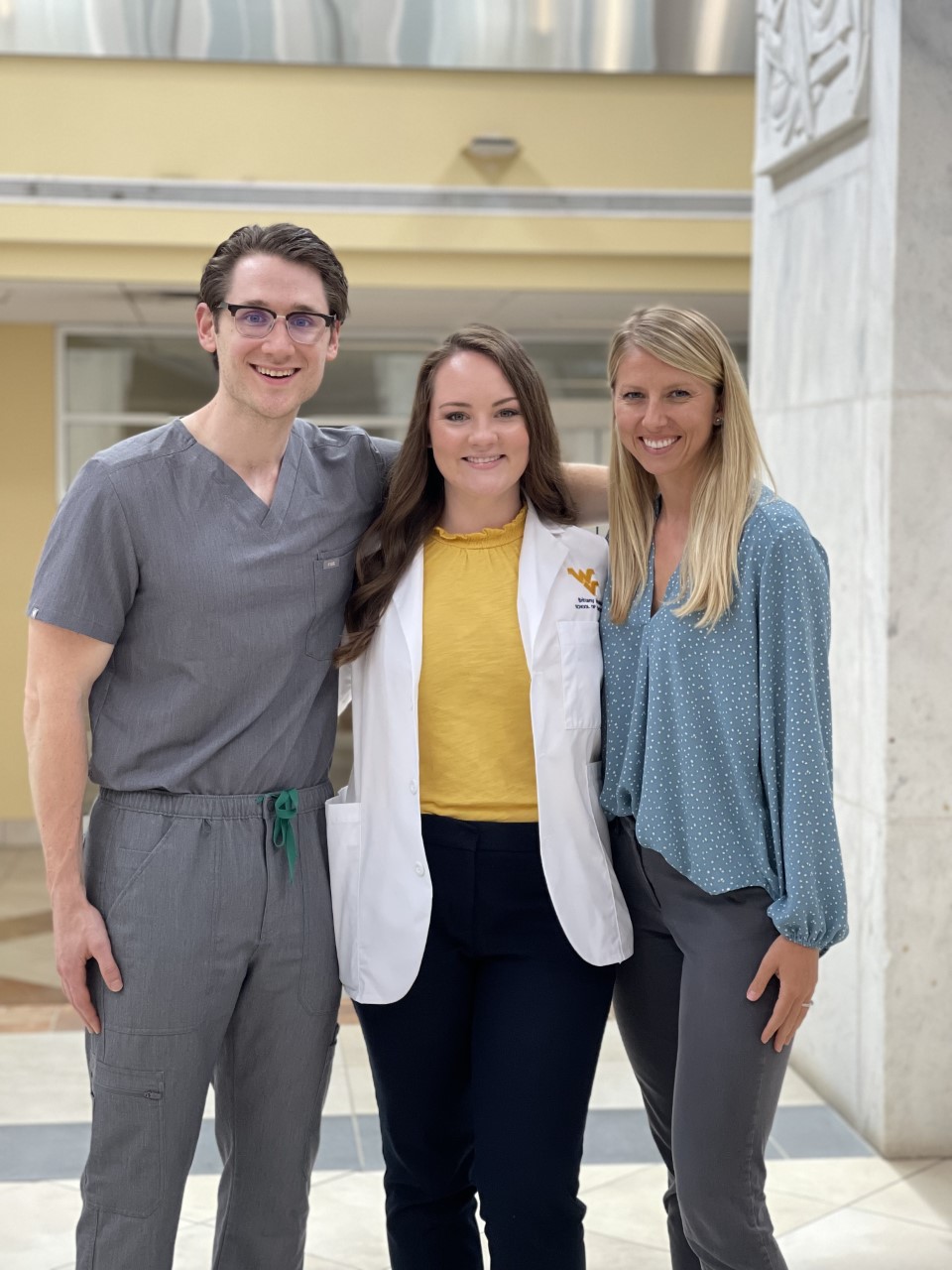 Dr. Matt Harper, Dental Student Brittany Moleta, Dr. Lauren Godwin